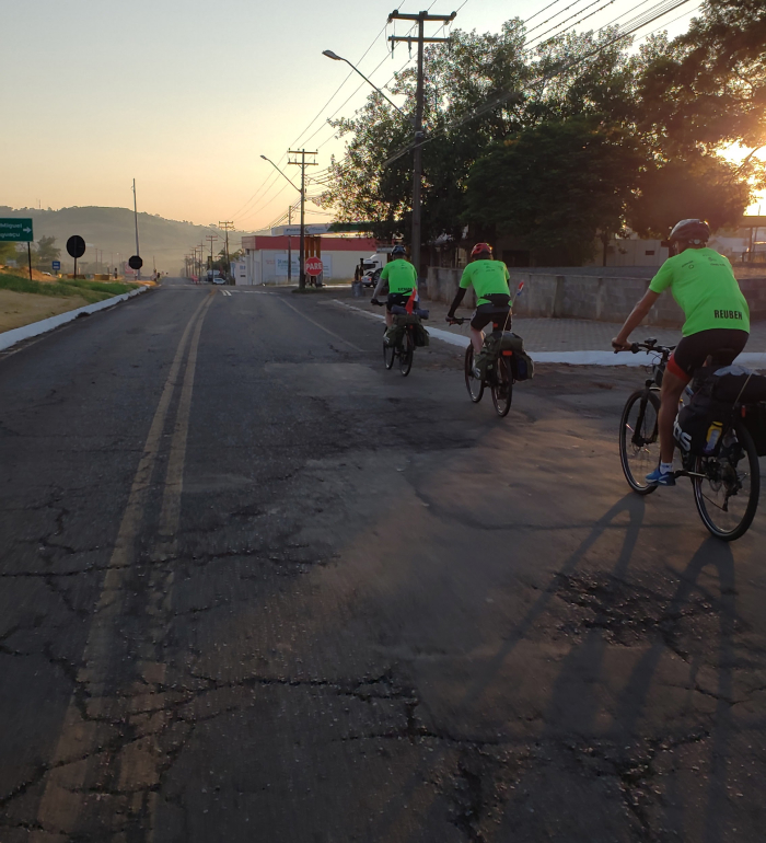 image of bikers on a hill, illustrating English vocab word "perseverance"